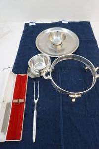 stainless steel serving dishes and fork