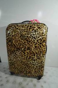 lot 97 image: Amelia Earhart Hardsided Animal Print Rolling Suitcase