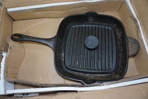 lot 184 image: Cast Iron Skillet and Press