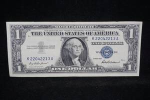 lot 242 image: 1957 $1 Blue Seal Silver Certificate