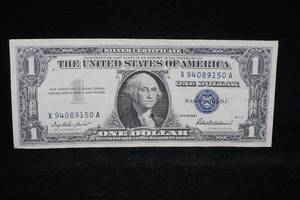 lot 243 image: 1957 $1 Blue Seal Silver Certificate