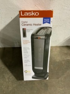 Lasko Tower 22 in. Electric Ceramic Oscillating Space Heater with Digital Display and Remote Control. See Pictures