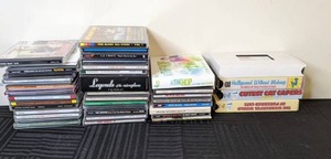 lot 127 image: Assorted CDs and (4) VHS Tapes (Cat Videos, Bob Dylan, k.d. lang, Sinatra, Harry Connick Jr, Hank Williams, Chopin, Grieg, Ricky Martin, and more)