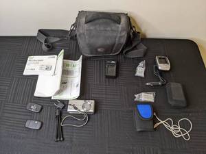 lot 113 image: Canon PowerShot A400 and Canon PowerShot SD870 IS Digital Cameras and Accessories (Targus High Speed SDSDHCMMC Card ReaderWriter, Cables, Carry Bags, etc.)