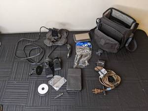 lot 107 image: Garmin Nuvi GPS Navigation with Assorted Car Mounts, Chargers, Cases, etc.
