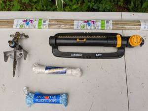 lot 356 image: Lawn and Garden Items Bamboo Stakes, Sprinklers and All Purpose Rope