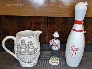 lot 33 image: Collectible Liquor Containers Cutty Sark Pitcher, Nassau Royale Soldier, Beams Ten-Pin