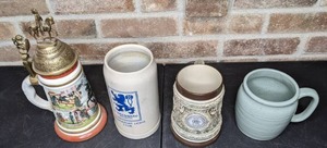 lot 248 image: A Set of Four Unique Beer Steins