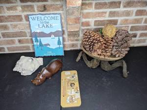 lot 240 image: Wood Bowl of Pinecones with Ram Horn-Style Bottom, Hand Painted Outdoor Thermometer, Wood-Carved Rhino, Spiral Sea Shell, Welcome to the Lake Sign