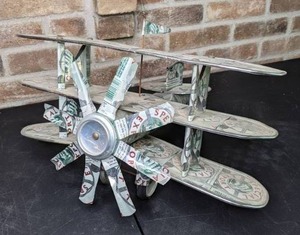 lot 30 image: Decorative Propeller Triplane Made of Heileman Special Export Beer Cans