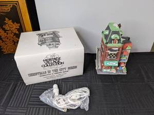 lot 416 image: Heritage Village Collection, Christmas in the City Series, Dorothys Dress Shop, 1989. Lighted Ceramic House