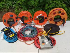 lot 387 image: 9-Piece Lot Extension Cords, Most on Reels,  Husky 100 Ft. is Brand NEW