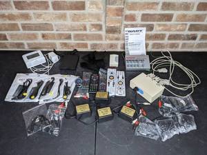 lot 514 image: Assortment of Miscellaneous Electrical Remotes, Cords, Pyramid High Quality Noise Suppressor, Nady Audio 4-Channel Stereo Mini Mixer, USB Portable Floppy Drive, Mini Timer and More