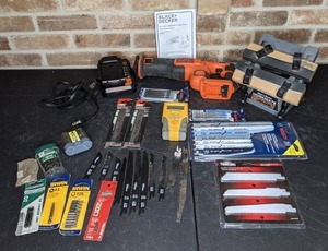 lot 607 image: Black and Decker Reciprocating Saw, Workmate Bench Top Work Center, Assortment of Blades and More