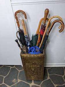 lot 581 image: Tall Brown Gold Colored Entryway Umbrella Holder with Cane and  Umbrellas
