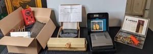 lot 571 image: Mixed Lot Vintage Polaroid Spectra System Camera, Solar Powered Fountain Pump, Plate HangersDisplays, and Much More