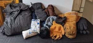 lot 562 image: Winter Outerwear Snozu XL Jacket, 2 Ponchos, Hats, Gloves, Mittens and Earmuffs