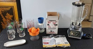 lot 556 image: Mixed Lot of Kitchen Items Vintage Waring Timer-Light Blendor, Presto Powercup Concentrators, Glassware, Juicer and More