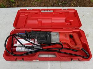 lot 16 image: Milwaukee Heavy Duty Corded Sawzall with Multiple Spare Saw Blades in Case