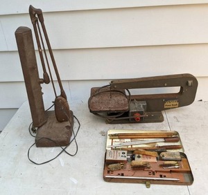 lot 801 image: Vintage Montgomery Ward Powr Kraft Scroll Saw, Industrial Table Lamp, and Gun Cleaning Kit