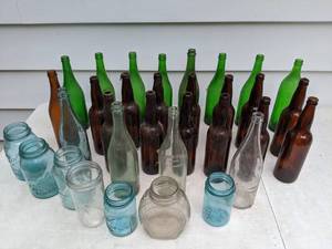 lot 702 image: 26 Vintage Green, Brown and Clear Glass Bottles and 7 Vintage Blue and Clear Glass Jars