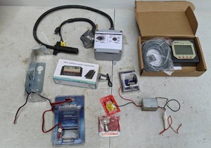 lot 719 image: Mixed Lot Duo Battery Solar Controller, 7 Amp Solar Charge Controller, 6-Way Vehicle Connector, and More