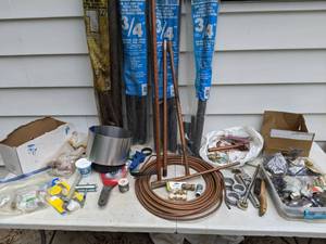 lot 750 image: Assortment of Tools Pipe Insulation, Superior Tool Plumbers Pal, Parts to Hoses and More