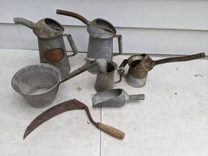 lot 683 image: Group of 4 Vintage Galvanized Cans with Spouts, Galvanized Scoop and Pot with Handle, and Vintage Sickle