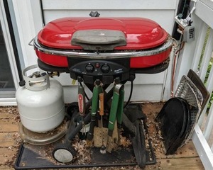 lot 695 image: Road Trip Propane BBQ Grill with Cover, BBQ Grilling Tools, and Other Accessories