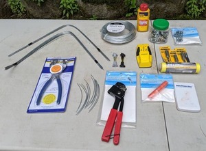 lot 711 image: Mixed Lot of Mostly New Tools and Hardware Punch Pliers, Hanger Wire, Marking Chalk, 3 DeWalt Eye Lag Drivers and More