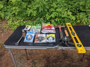 lot 725 image: Assortment of Tools Level, Hammer, Abrasive Nylon Flap Brush, Knot Wire Cup Brush, Wire Wheel and Cup Brush Set and More