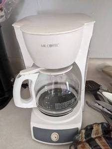 lot 717 image: Kitchen Items Mr. Coffee Coffee Maker & Pot, Kitchen Utensils, Vintage Leonard Silverware, Cookbooks and More