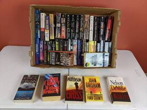lot 112 image: Assortment of Paperback Books by James Patterson, Tom Clancy, Vince Flynn, Nelson DeMile and More
