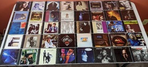 lot 37 image: Collection of 40 CDs Norah Jones, Eric Clapton, Credence Clearwater Revival, Kenny G, and More