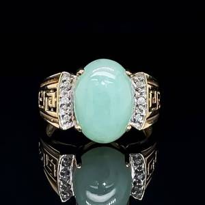 lot 45 image: Statement-Worthy Oval Jade Cabochon & Diamond Meandros Greek Key Tapered Band Ring in Yellow Gold