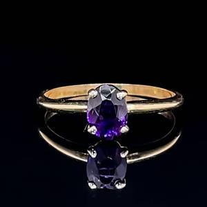lot 110 image: Estate Rich Purple Oval Amethyst Solitaire Birthstone Stacking Ring in 14k Yellow Gold