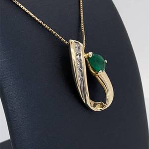 lot 42 image: Gorgeous Green Raindrop Natural Emerald & Diamond Ribbon Slide Pendant in 14k Yellow Gold