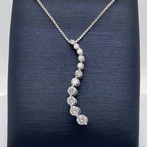 lot 72 image: Stunning Scintillation 1.00 CARAT Round Brilliant Diamond Graduated Wave Journey Pendant in White Gold $1899 Retail
