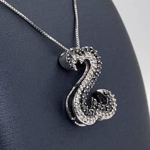 lot 94 image: Fancy Black & White Diamond Double Heart Wave Pendant in 14k White Gold
