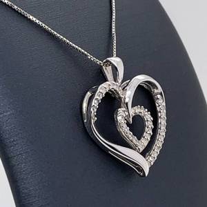 lot 100 image: Romantic Elegance Diamond Double Halo Ribbon Heart Pendant in 14k White Gold