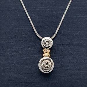 lot 73 image: Contemporary and Classy 0.50ctw Diamond 2-Stone Solitaire Bezel Pendant Snake Chain Necklace in 14k Two-Tone Gold $1599 Retail