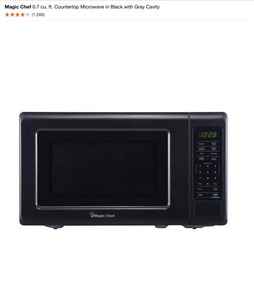 Magic Chef 0.7 cu. ft. Countertop Microwave in Black with Gray Cavity. See Pictures