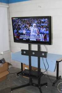 lot 123 image: 37 HD Sylvania Flatscreen Television  TV  Display with Sharp DVD Player and Rolling Stand