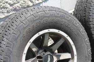 lot 150 image: Jeep Wrangler Eagle Alloy Wheels  Rims and 2857017 Tires - Set of 5