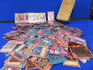 YU-GI-OH CARDS AND A TIN