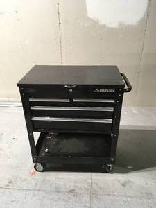 Husky 33 in. W 4-Drawer Mechanics Tool Utility Cart in Gloss Black used have some starchs or dents - review all pictures