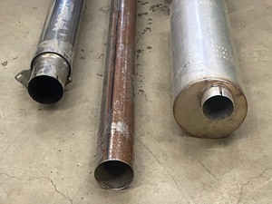 lot 31 image: Commercial Truck Exhaust Lot (1) 21833 Muffler -- (1) 12 x 48 Heat Shield -- (1) 5 x 106 Stainless Exhaust Pipe -- (1) 6 x 7ft Stainless Exhaust Stack -- All Are Unused