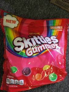 lot 199 image: 512oz packages of skittles gummies...