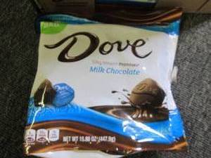 lot 239 image: 615.80 oz bags of dove milk chocol...