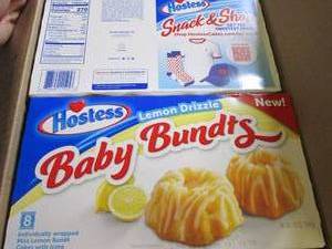 lot 252 image: 6 boxes of Hostess Lemon Drizzle ba...